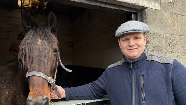Robert Humphrey with one of his horses in a stable in Dublin 