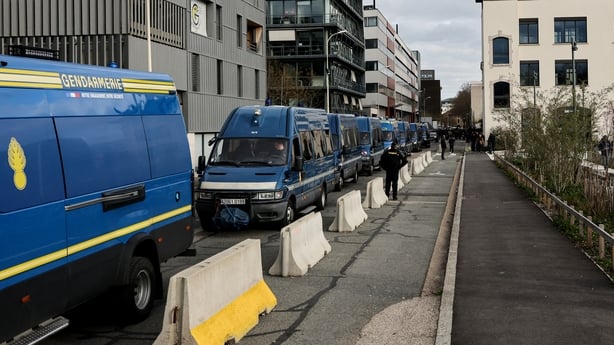 Cars of French Gendarmes are parked during a protest in Lyon
