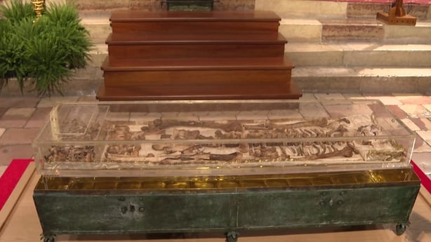 This video grab shows the remains of St Francis of Assisi on display in a glass case