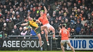 22 February 2026; Jason McGee of Donegal in action against Tiernan Kelly of Armagh during the Allianz Football League Division 1 match between Armagh and Donegal at BOX-IT Athletic Grounds in Armagh. Photo by Ramsey Cardy/Sportsfile