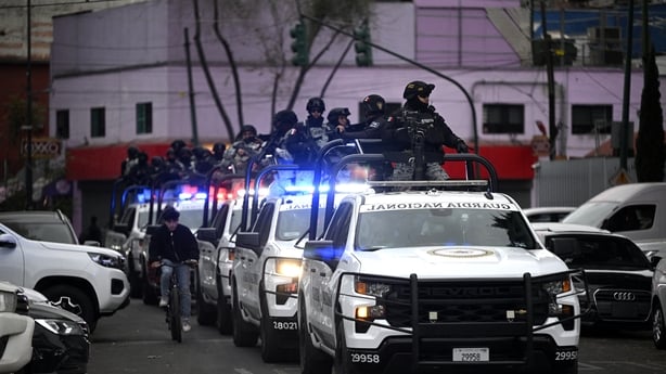 Mexican National Guard special forces patrol around the Specialized Prosecutor's Office for Organized Crime (FEMDO) headquarters in Mexico City on February 22, 2026. Mexico confirmed on February 22, 2026, that soldiers killed a powerful drug cartel leader who was one of the most wanted men here and