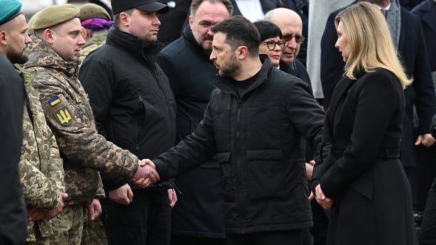 KYIV, UKRAINE - FEBRUARY 24: Ukrainian President Volodymyr Zelensky and First Lady Olena Zelenska meet troops in Independence Square following the ceremony to commemorate the fourth anniversary of Russia's full-scale invasion of Ukraine on February 24, 2026 in Kyiv, Ukraine. The UK Foreign Secretary