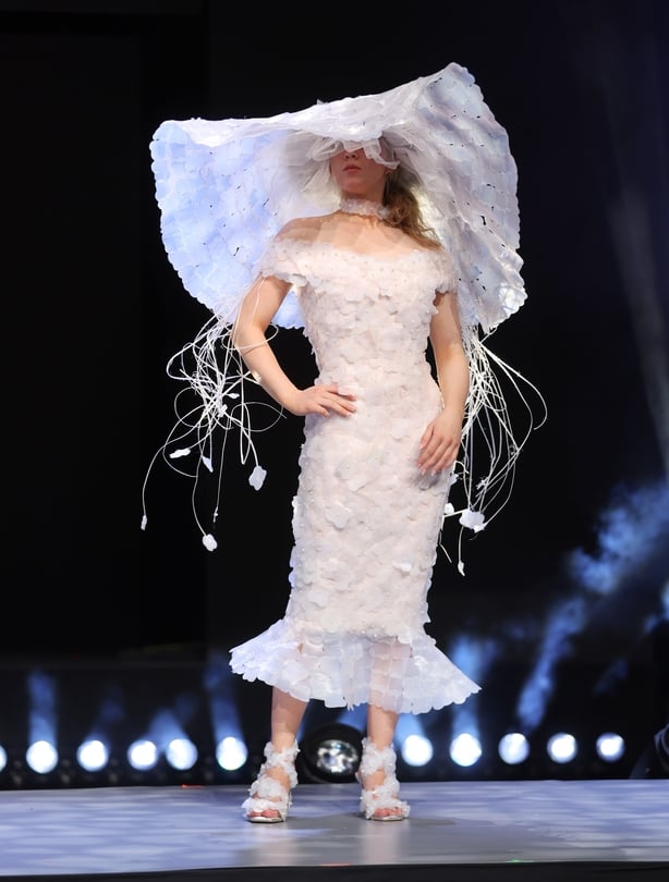 Student Emilija Milasiute pictured ahead of the Junk Kouture World Final in the Helix in the creation La La Lu Veil by Emilija Milasiute of St Joseph's Secondary School, Westmeath Ireland, made from plastic milk bottles, plastic packaging straps, pearl beads a sculptural wide-brimmed hat create a lu