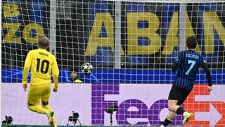 Jens Petter Hauge of Bodo Glimt (l) scores first goal against Inter Milan in 2025-26 Champions League play-off second leg
