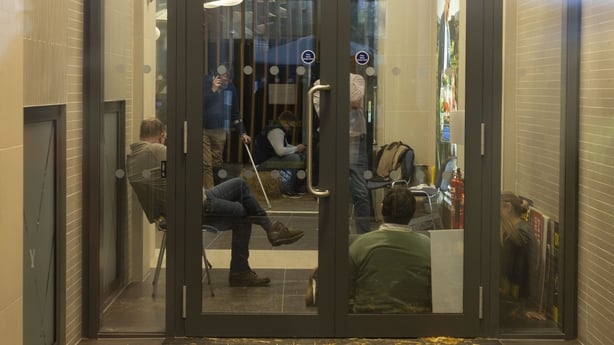 Members of the Irish Farmers Association sit inside the Bord Bia HQ as part of a sit-in protest.