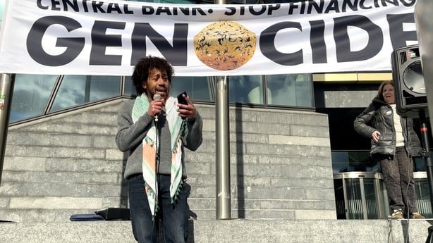 People Before Profit councillor Darragh Adelaide speaks during a pro-Palestine protest outside the Central Bank in Dublin