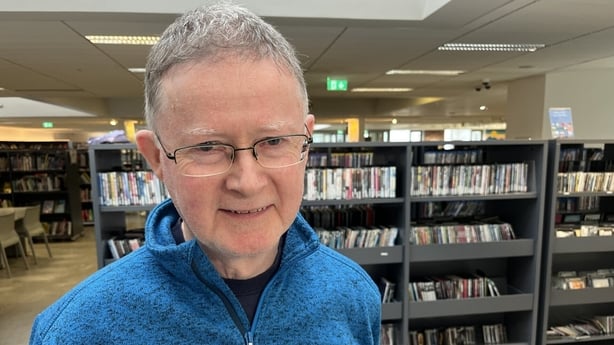 Seamus Whelan stands in Tallaght library