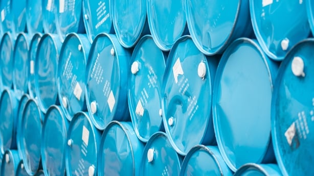 A stack of bright blue barrels