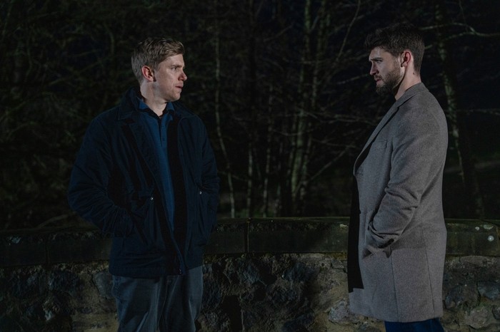 Robert and Joe meet-up late at night in a scene from Emmerdale