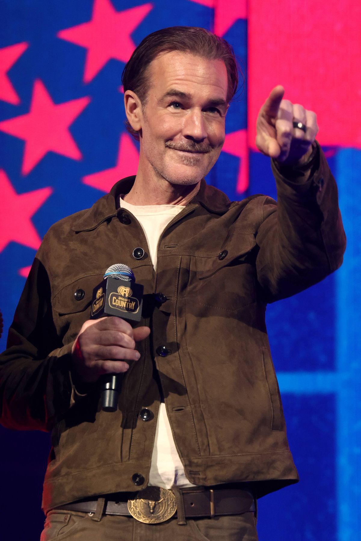 AUSTIN, TEXAS - MAY 03: James Van Der Beek speaks onstage during the 2025 iHeartCountry Festival presented by Capital One at Moody Center on May 03, 2025 in Austin, Texas. (Photo by Gary Miller/Getty Images for iHeartRadio)