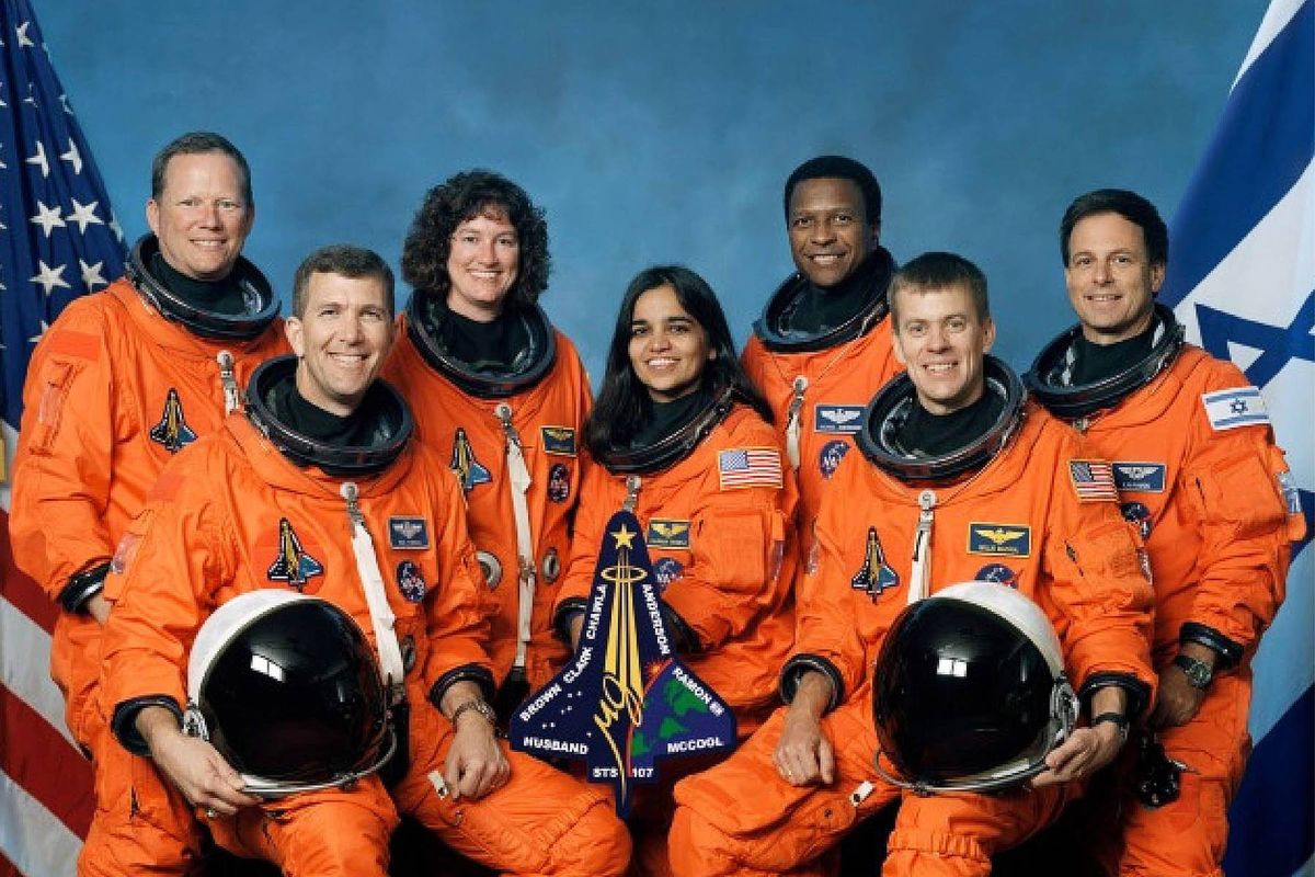 The seven astronauts who died on Space Shuttle Columbia  wearing their orange space suits 