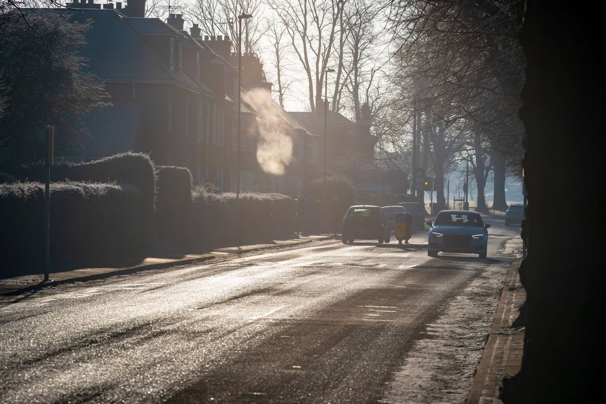 Frost snow covers roads and cars in UK
