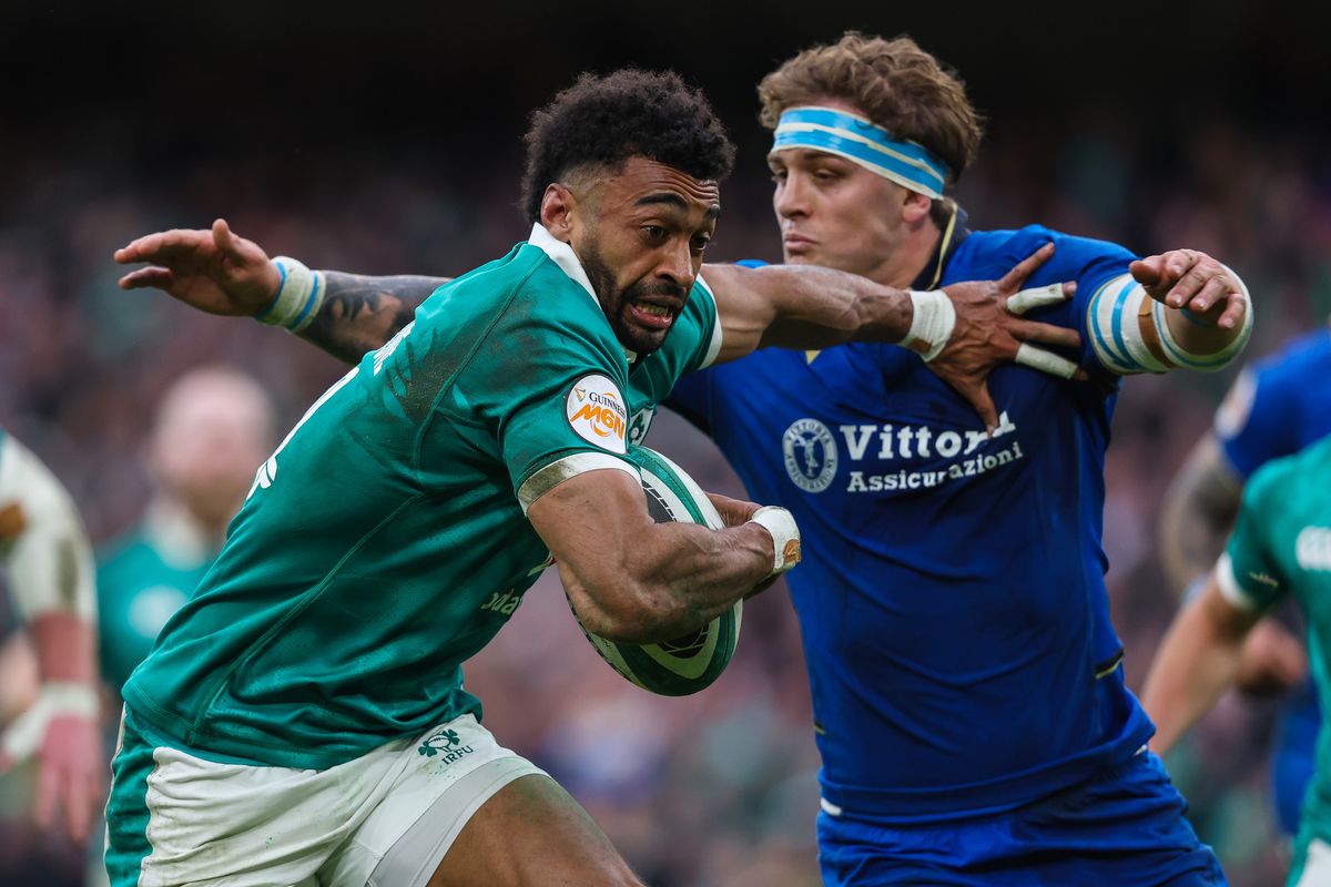 Ireland's Robert Baloucoune scores his sides third try of the match despite Italy's Lorenzo Cannone