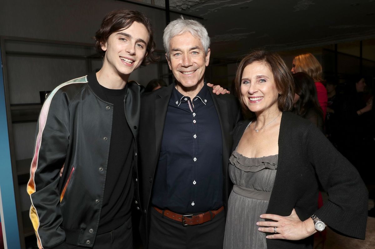 Timothee Chalamet posing alongside his parents Marc Chalamet and Nicole Flender