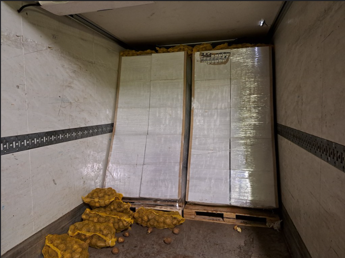 The cigarettes hidden in the lorry and a few of the sacks of potatoes that were hiding them.