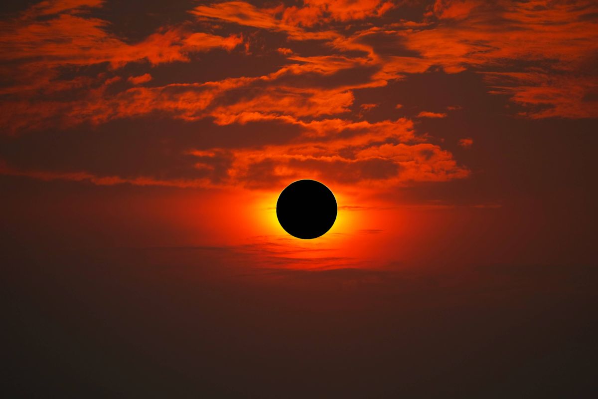 Total solar eclipse on the red orange sky in the morning, Elements of this image furnished by NASA