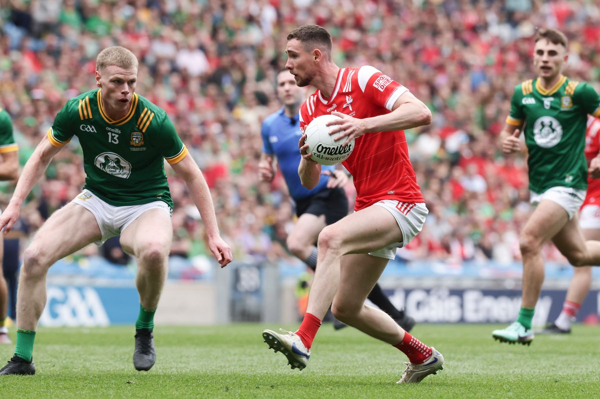Louth's Ciaran Downey is challenged by Mathew Costello of Meath