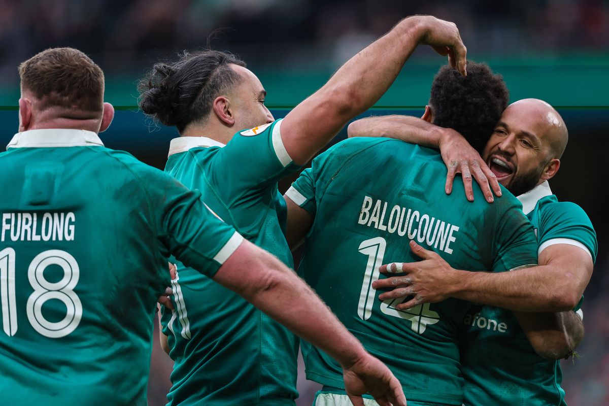 Ireland's Robert Baloucoune celebrates scoring his sides third try of the match with Jamison Gibson-Park and James Lowe