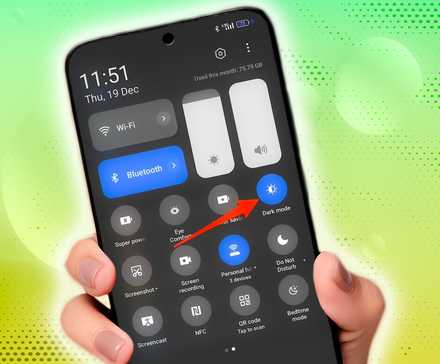 hand holding android phone showing quick settings menu