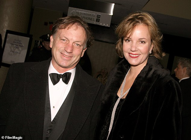 Colin with her husband Justin Deas in 2014