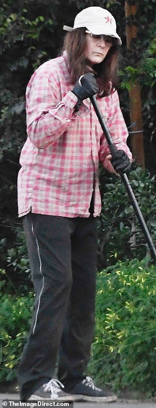 She was seen busily ensuring her Los Angeles home looked its best