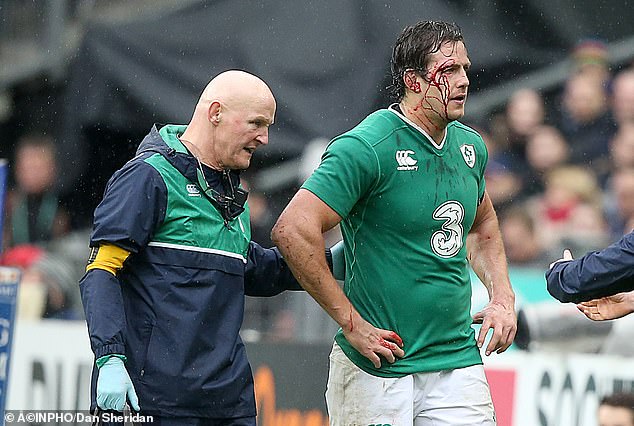 Ireland's Mike McCarthy leaves the Stade de France pitch with a blood injury in 2016