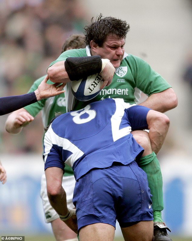 Ireland's Reggie Corrigan is tackled by Julien Bonnaire of France during the sides' 2006 Six Nations game in Paris