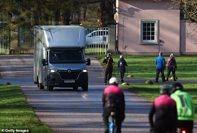 A removals van leaves the gates of Royal Lodge in Windsor Great Park on Wednesday
