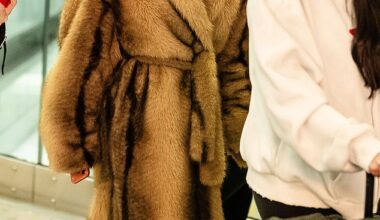 Charli XCX wrapped up in a fur coat as she landed in London on Wednesday after flying in from New York - following backlash to Jason Bateman grilling her on not wanting children