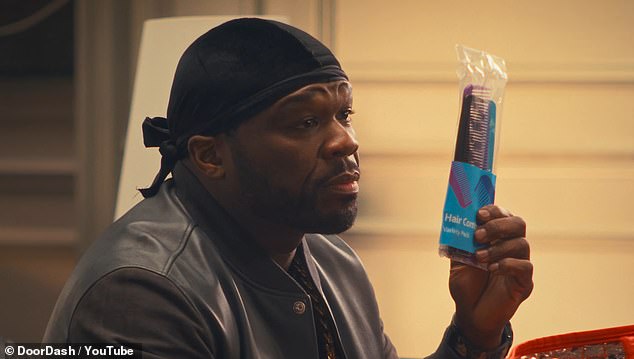 50 Cent pulls out a comb from the bag - an obvious dig at the Combs in Diddy's name