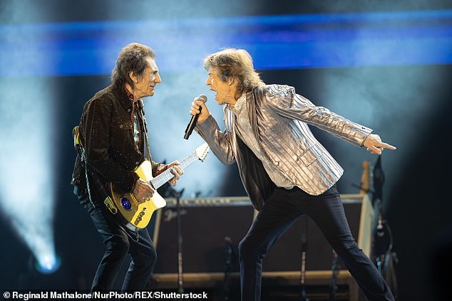 During the height of his struggles with addiction, his finances became so strained that he was forced to borrow a reported £250,000 from his bandmates (Mick and Ronnie pictured in 2024)