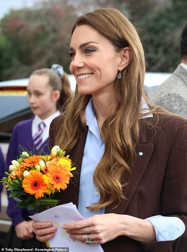 Photos from the outing also showed delighted pupils lining up to gift the princess with flowers, which she gratefully accepted