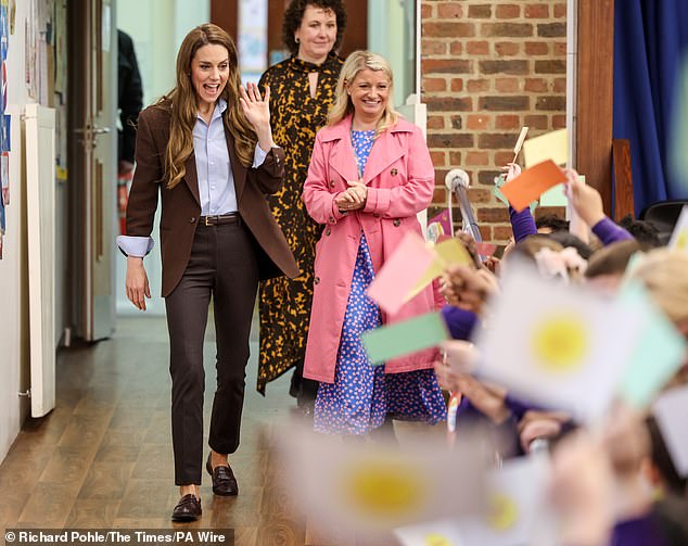 An excited Kate surprised children at the school with a visit, and joined in for some arts and crafts