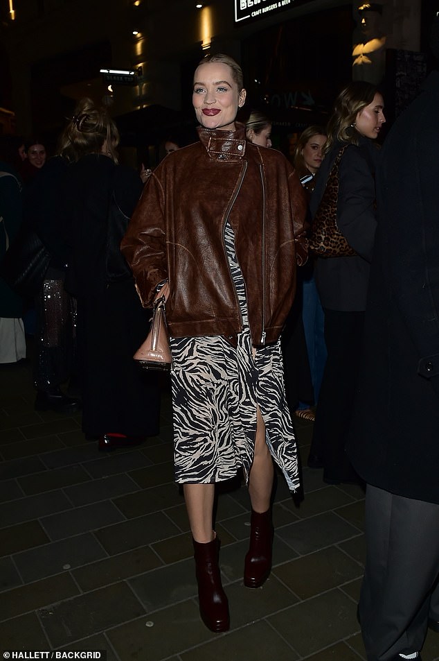 The former Love Island host accessorised with a Louis Vuitton bag and boots