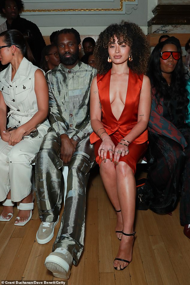 The singer took her seat on the front row beside Wretch 32