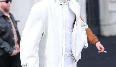 Romeo Beckham stepped out in an all white attire for Gucci's show during Milan Fashion Week on Friday