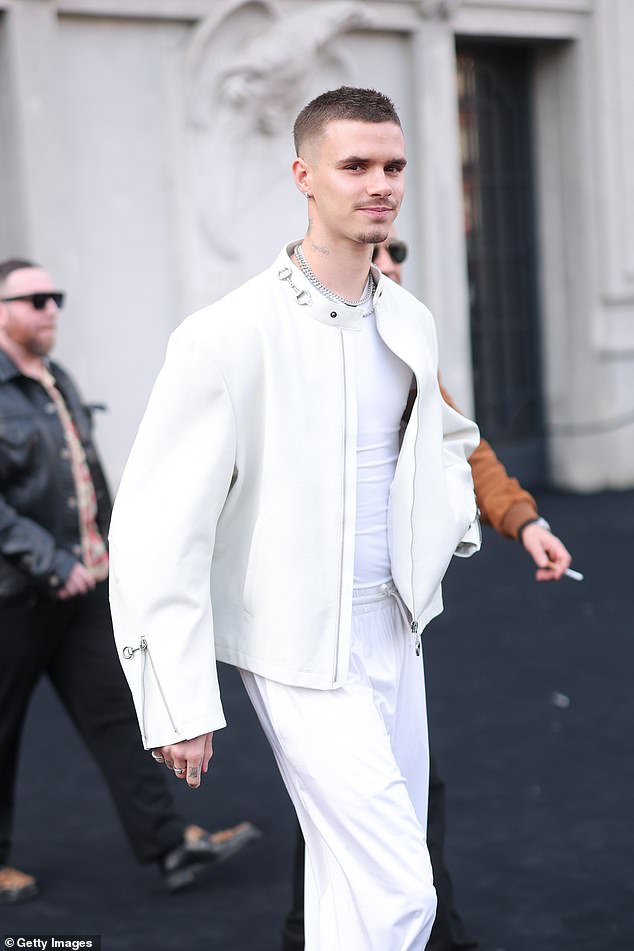 Romeo Beckham stepped out in an all white attire for Gucci's show during Milan Fashion Week on Friday