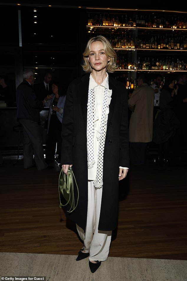 British actress Carey Mulligan who stepped out in an all white attire under a floor-length black coat