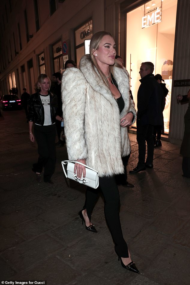 Aryna Sabalenka kept warm in a white faux fur jacket