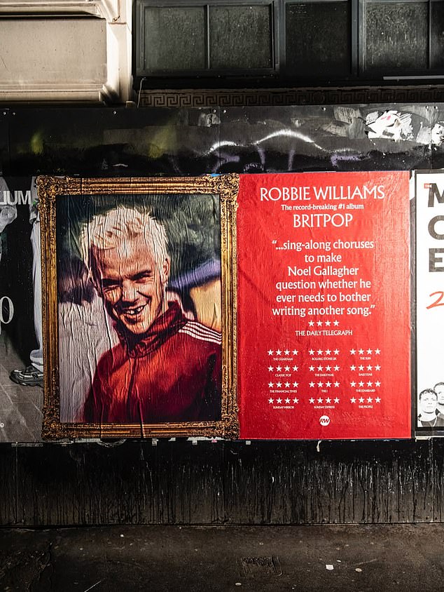 A billboard advertising Robbie's new album reads: 'A sing-along choruses to make question whether he ever needs to bother writing another song'