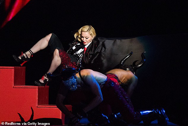 One of the BRITs most memorable moments was in 2015 when superstar Madonna's cape got stuck and she tumbled down the stairs live on air (Pictured)