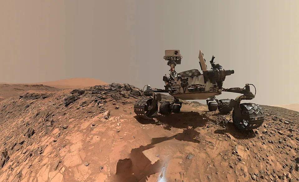 NASA's Curiosity Mars rover is seen at the site from which it reached down to drill into a rock target called 'Buckskin' on lower Mount Sharp in this low-angle self-portrait taken August 5, 2015 and released August 19, 2015. The selfie combines several component images taken by Curiosity's Mars Hand Lens Imager (MAHLI).