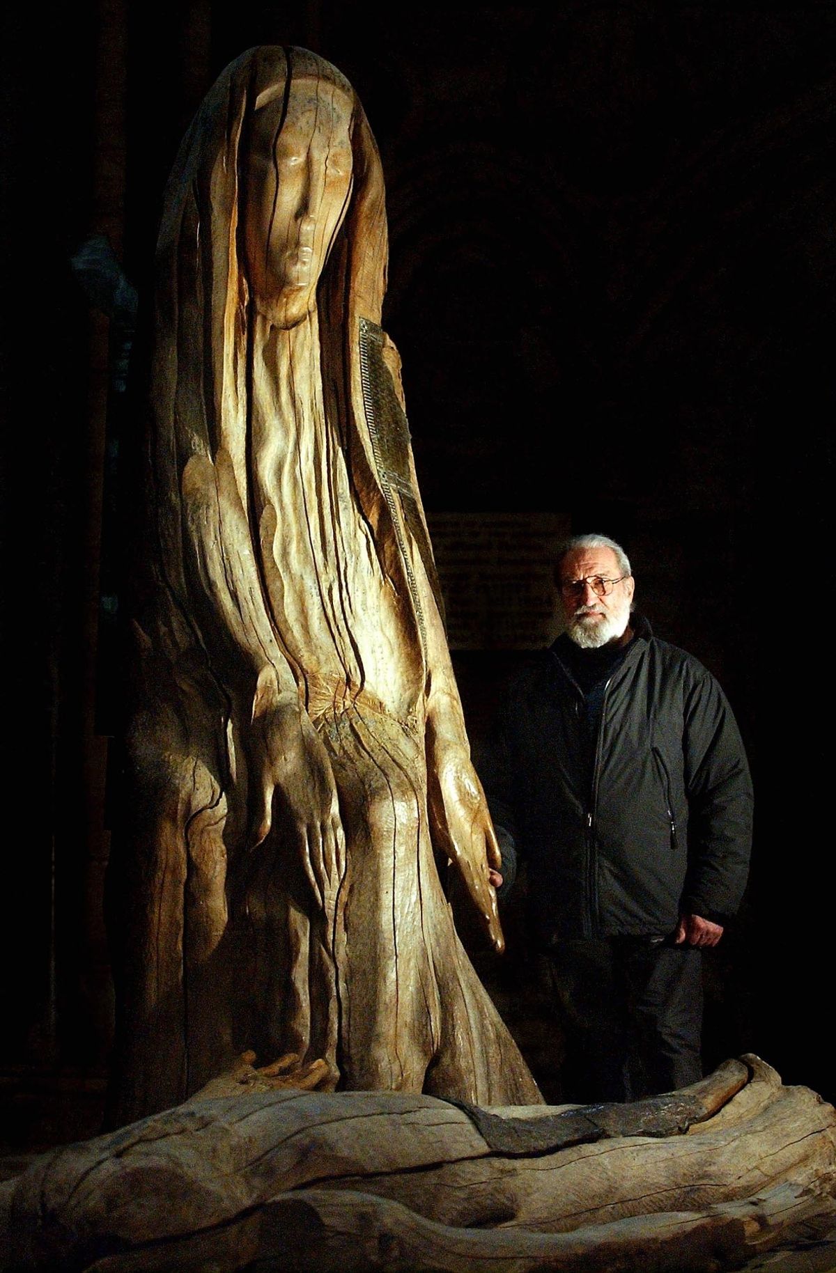 ARTIST FENWICK LAWSON, WITH HIS WORK THE PIETA AT DURHAM CATHEDERAL.