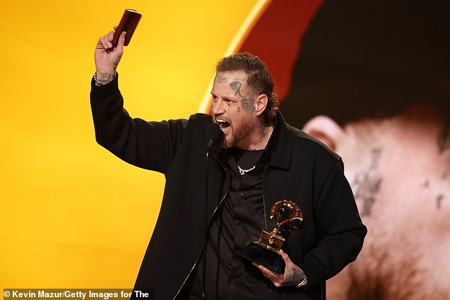 LOS ANGELES, CALIFORNIA - FEBRUARY 01: Jelly Roll accepts the Best Contemporary Country Album award for "Beautifully Broken" onstage during the 68th GRAMMY Awards at Crypto.com Arena on February 01, 2026 in Los Angeles, California.  (Photo by Kevin Mazur/Getty Images for The Recording Academy)