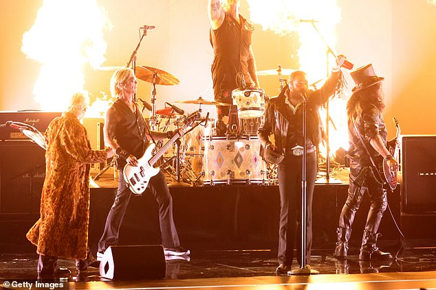 LOS ANGELES, CALIFORNIA - FEBRUARY 01: (FOR EDITORIAL USE ONLY) (L-R) Duff McKagan, Andrew Watt, Chad Smith, Post Malone and Slash perform onstage during the 68th GRAMMY Awards at Crypto.com Arena on February 01, 2026 in Los Angeles, California. (Photo by Frazer Harrison/Getty Images)