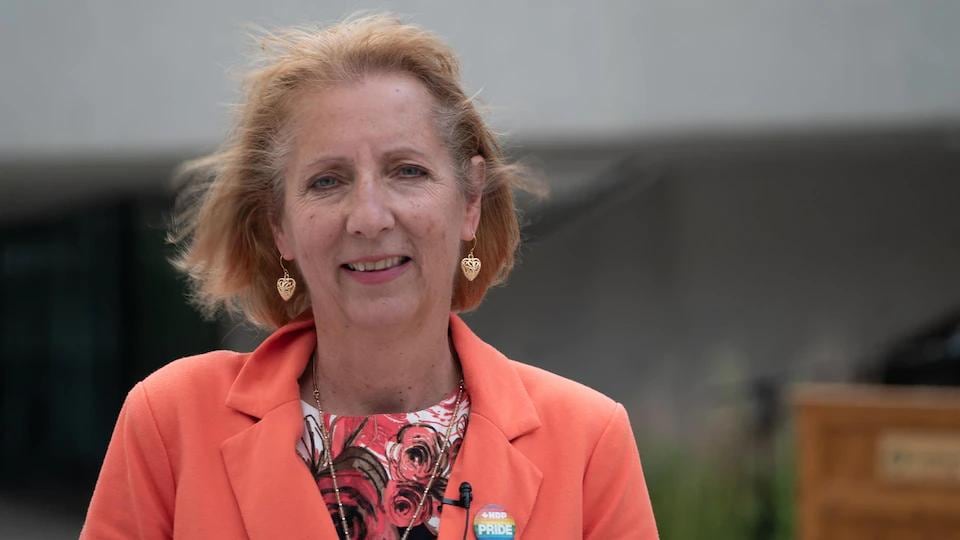 France Gélinas in an orange blazer