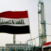 Iraqi flags flutter during the opening ceremony of a new oil refinery plant in the Shiite holy city of Najaf