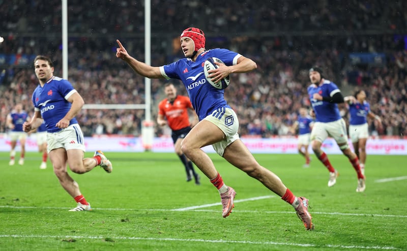 Louis Bielle-Biarrey points way to victory as he runs in to score France's first try. Photograph: INPHO