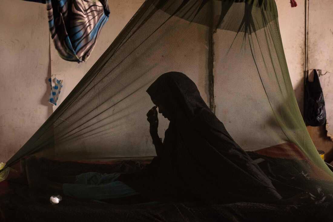 BARAWE, SOMALIA - A woman suffering from Tuberculosis sits in a bed at the Barawe General Hospital in Somalia.