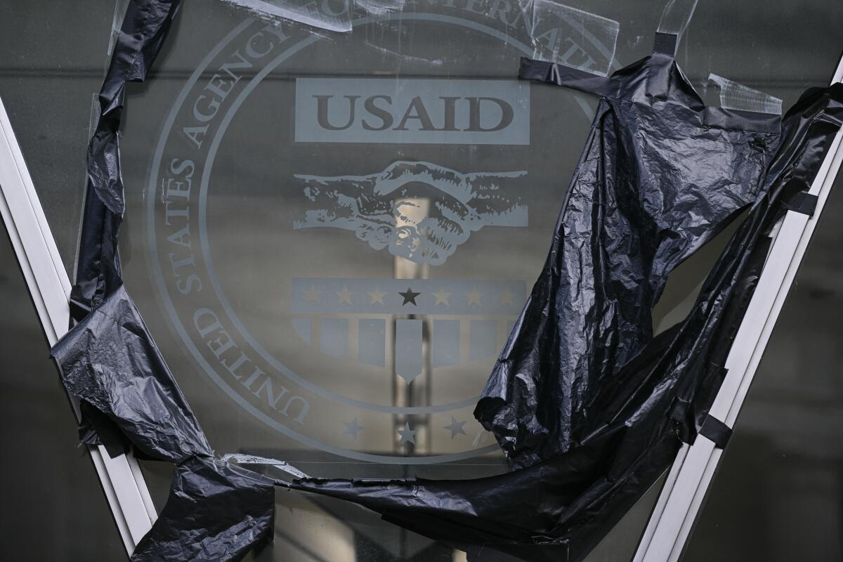 A "USAID" sign.